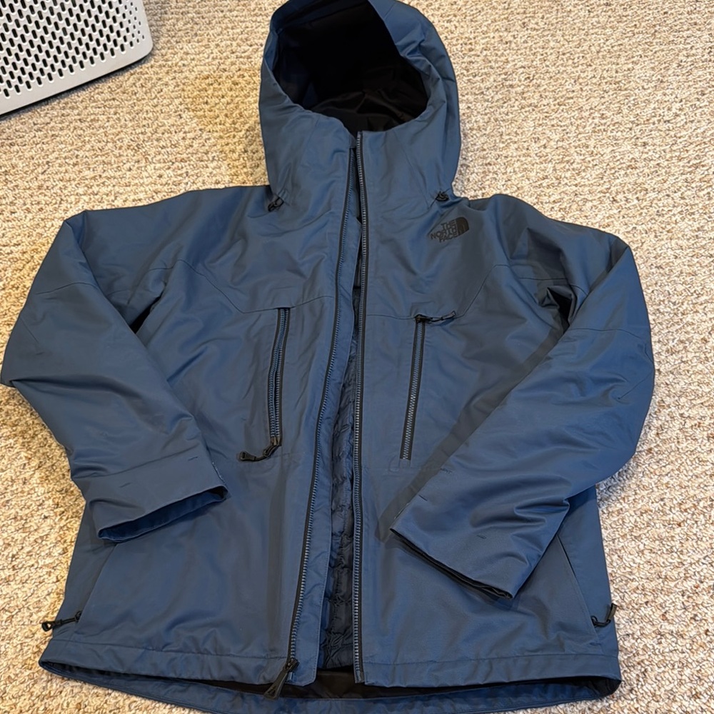 The North Face Blue Performance Jacket with Weather-Resistant Insulation